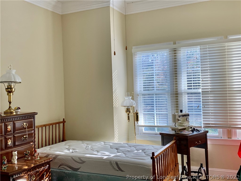 2651 Lockwood Road Fayetteville, NC 28303 - Photo 9 of 18 a bedroom with a bed and a window