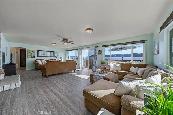 a bedroom with furniture and a large window