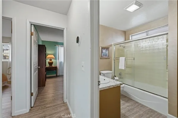 a bedroom with a bed and a table in it