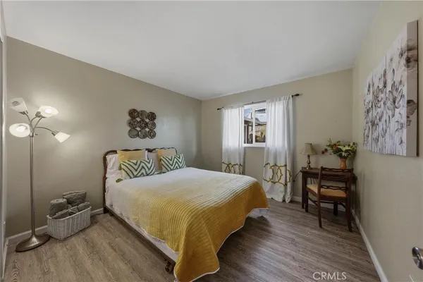 a bedroom with a bunk bed and a window