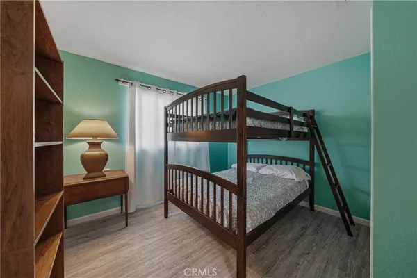 a bedroom with furniture and a window