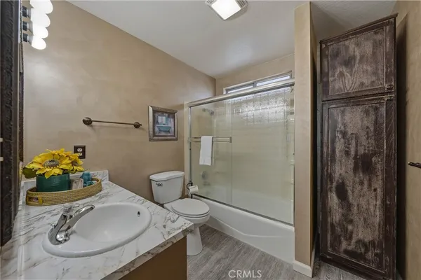 a bedroom with a bed and a closet