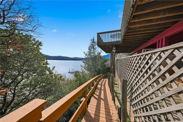 a view of a balcony with furniture and city view