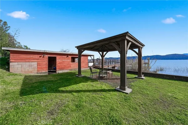 a view of a chair and table in the garden