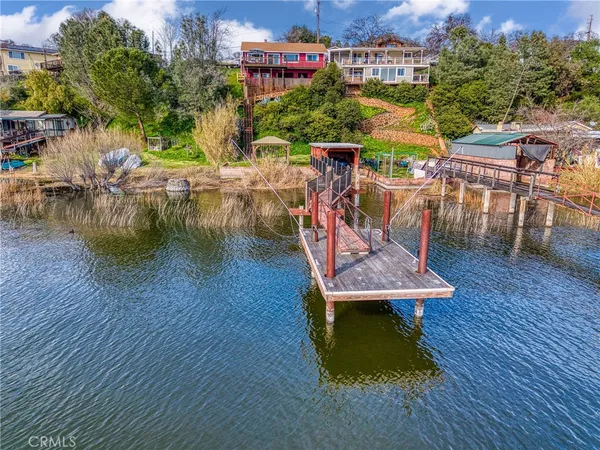 a view of a swimming pool with sitting area and furniture