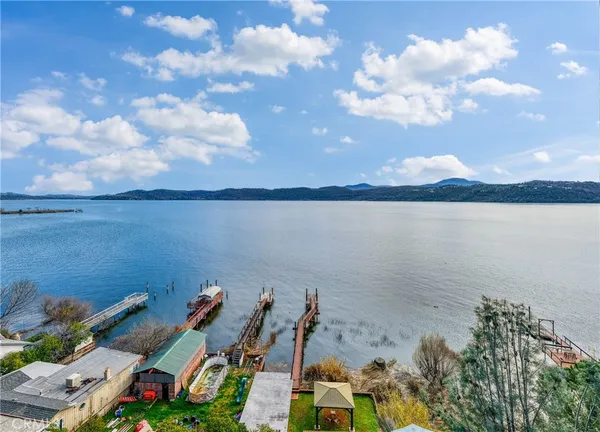 a view of a house with wooden fence