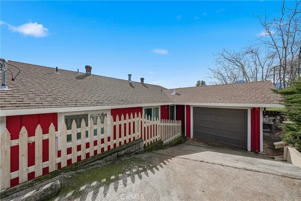 a backyard of a house with outdoor seating