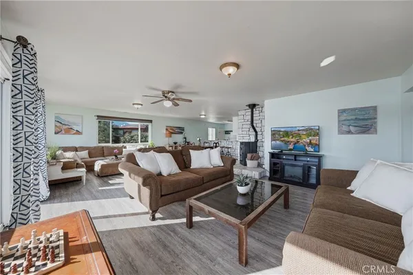 a living room with furniture and a rug