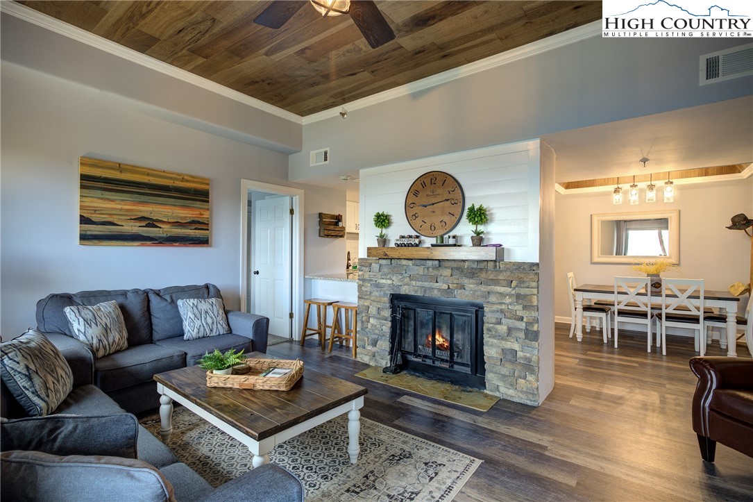 303 Sugar Top Drive, Unit 2407 Sugar Mountain, NC 28604 - Photo 1 of 36 a living room with furniture and a fireplace
