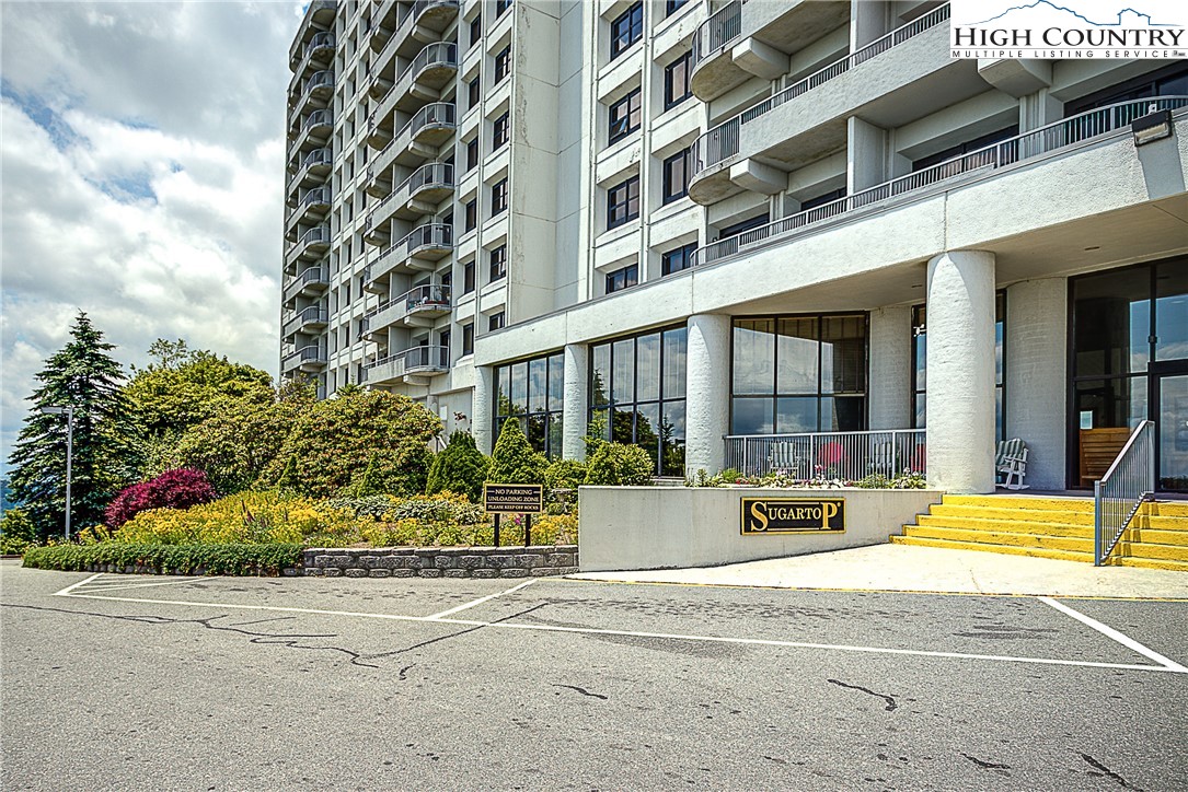 303 Sugar Top Drive, Unit 2407 Sugar Mountain, NC 28604 - Photo 25 of 36 a view of tall building with a outdoor space