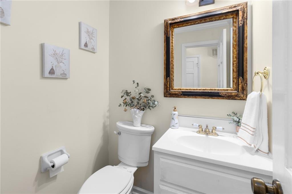 705 Springview Court Roswell, GA 30076 - Photo 16 of 79 a bathroom with a toilet sink and mirror