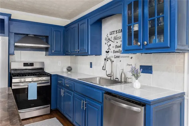 a view of a hallway with wooden floor and closet
