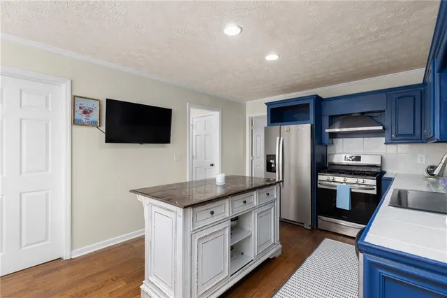 a view of a room with wooden floor