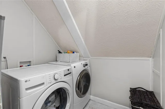 a view of a workspace with furniture and wooden floor