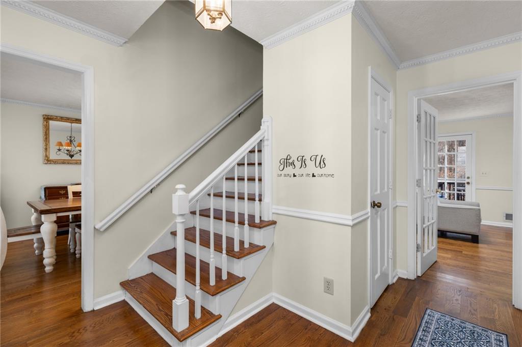 705 Springview Court Roswell, GA 30076 - Photo 4 of 79 a view of entryway and hall with wooden floor