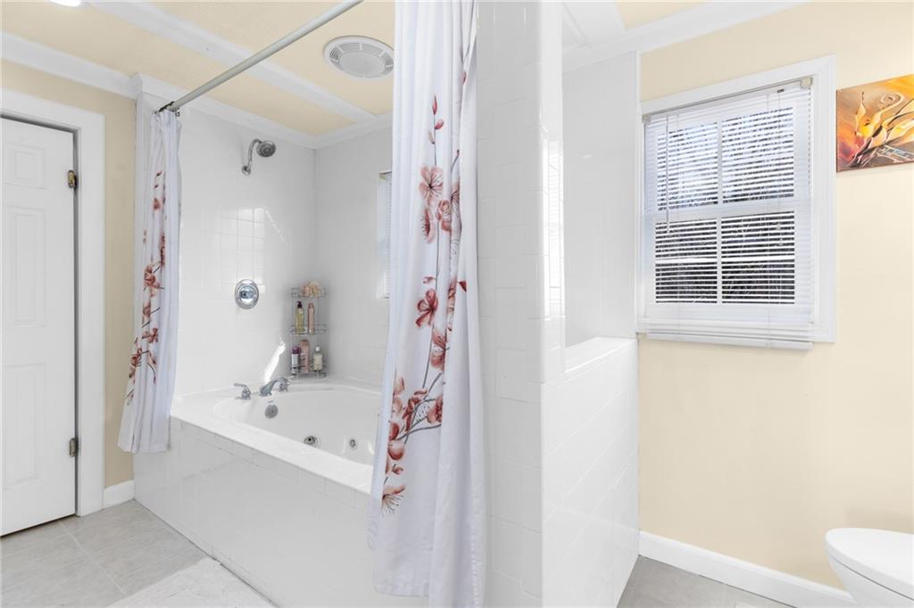 705 Springview Court Roswell, GA 30076 - Photo 41 of 79 a white bath tub sitting next to a white sink