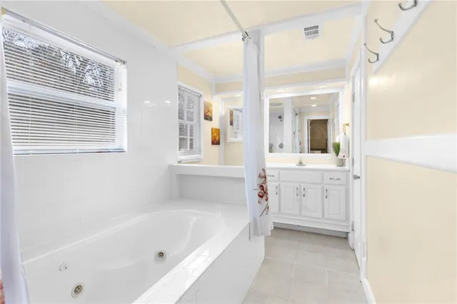 a room with pool table and wooden floor