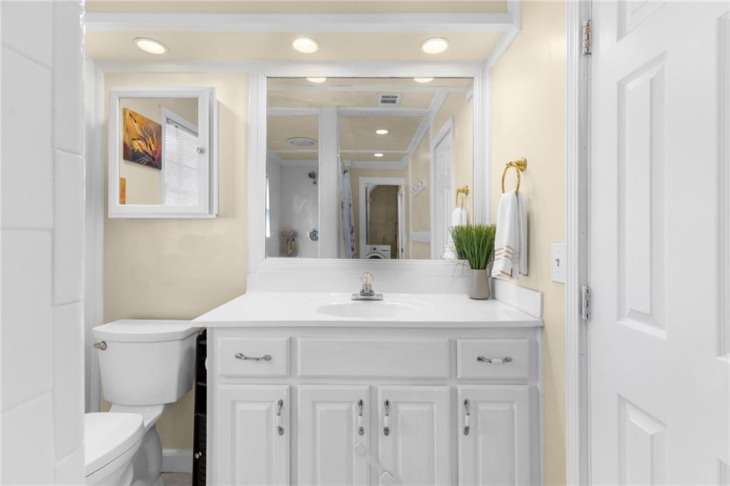 705 Springview Court Roswell, GA 30076 - Photo 44 of 79 a bathroom with a sink and a mirror