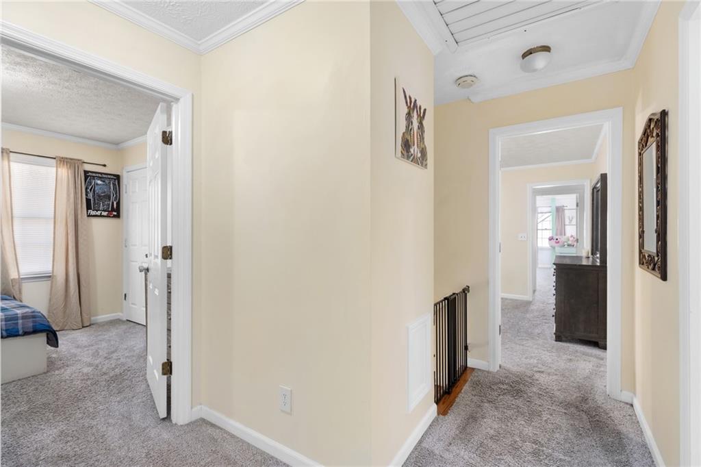 705 Springview Court Roswell, GA 30076 - Photo 46 of 79 a view of a hallway with wooden floor and closet