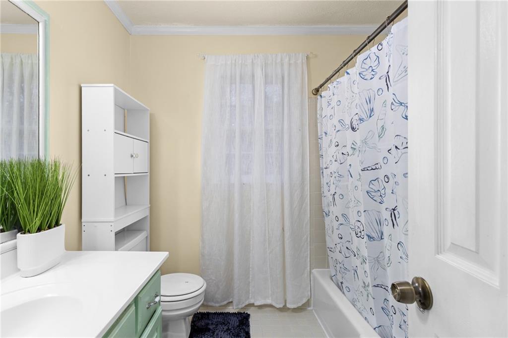 705 Springview Court Roswell, GA 30076 - Photo 48 of 79 a bathroom with a sink toilet and shower