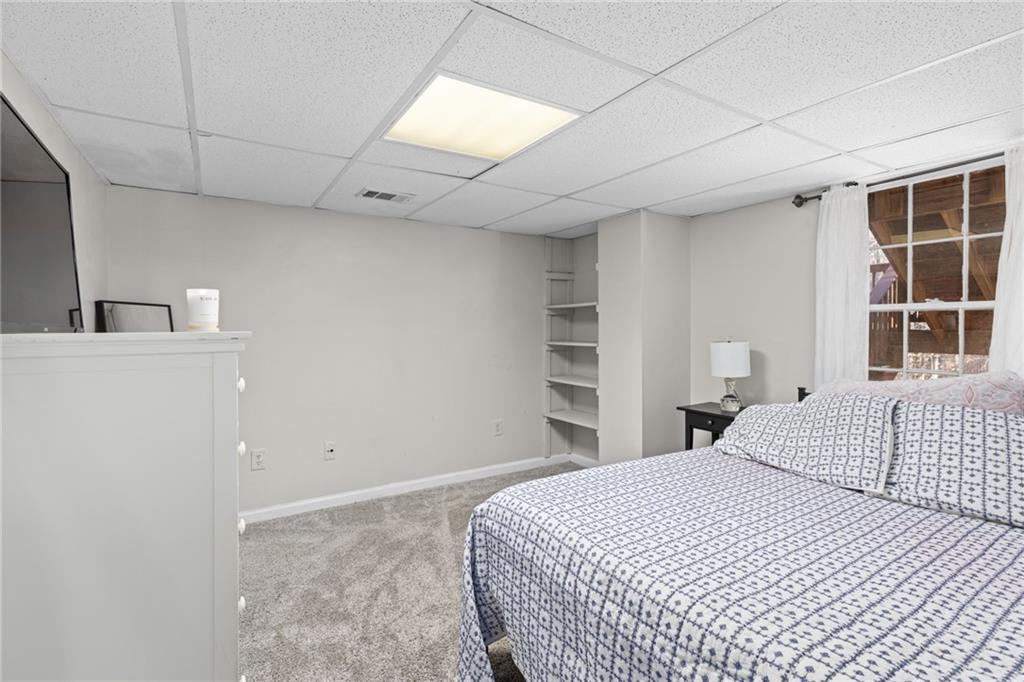 705 Springview Court Roswell, GA 30076 - Photo 61 of 79 a bedroom with a bed and a window