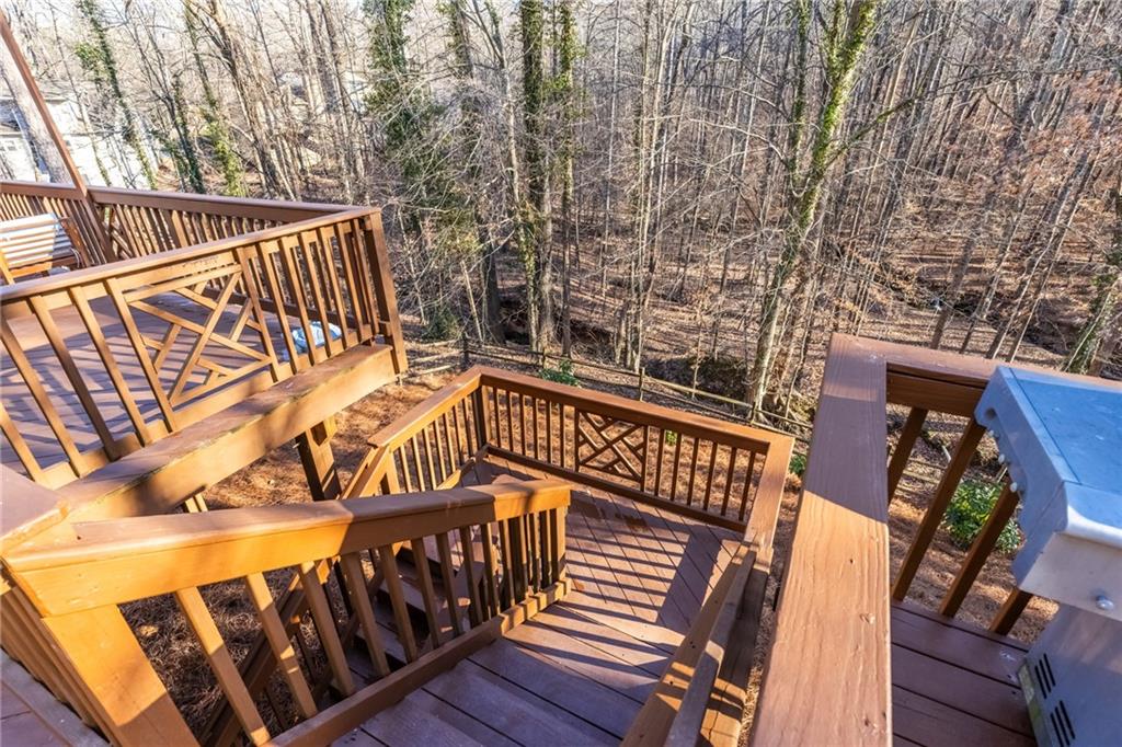 705 Springview Court Roswell, GA 30076 - Photo 68 of 79 a view of a roof deck with wooden fence and floor