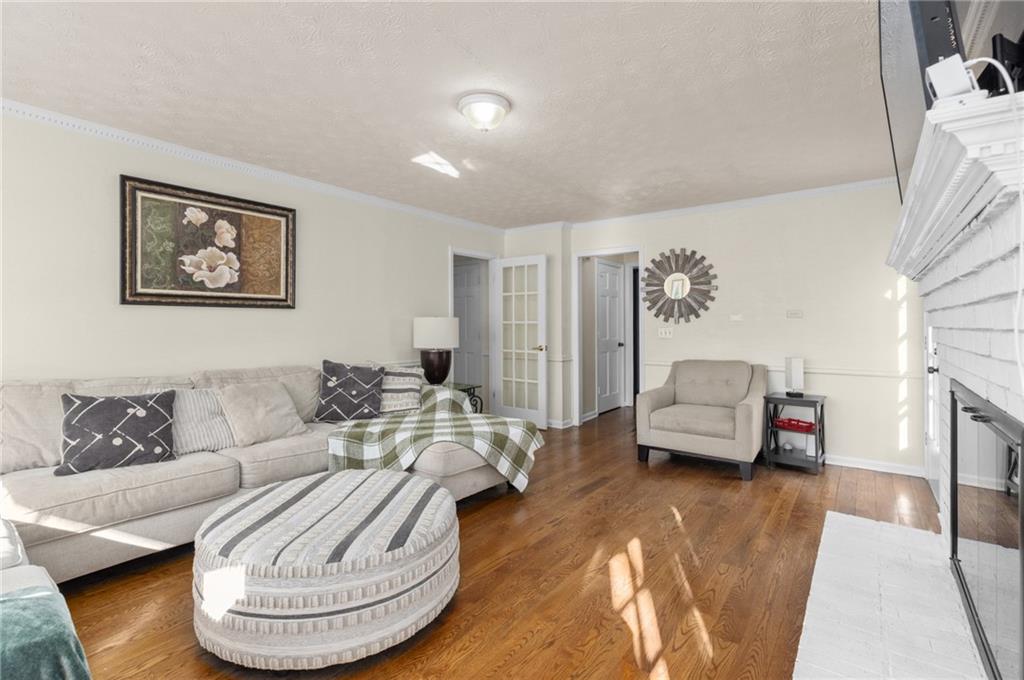 705 Springview Court Roswell, GA 30076 - Photo 10 of 79 a living room with furniture and a couch