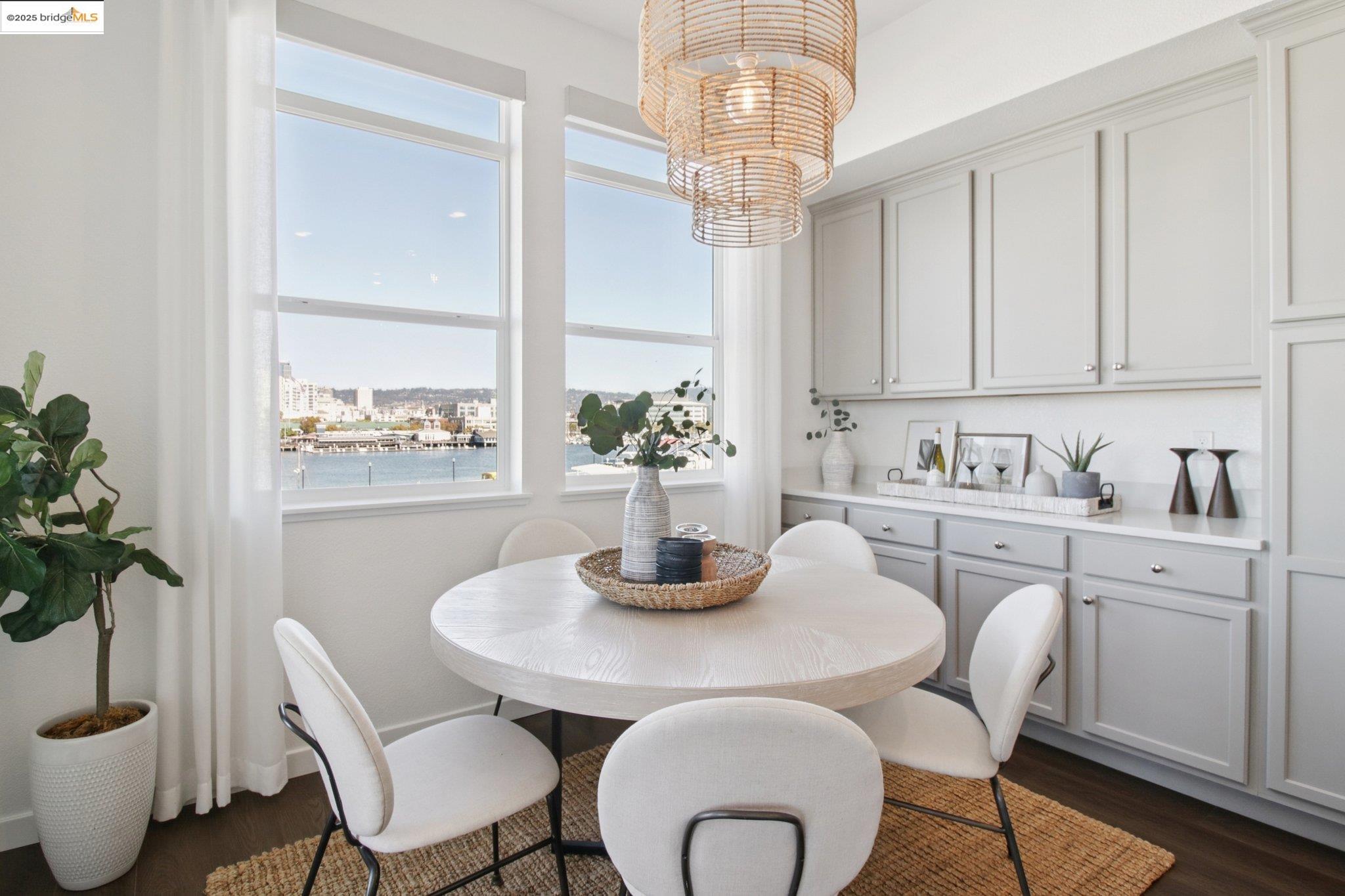 2878 5th Street Alameda, CA 94501 - Photo 12 of 56 a dining room with furniture a rug and wooden floor