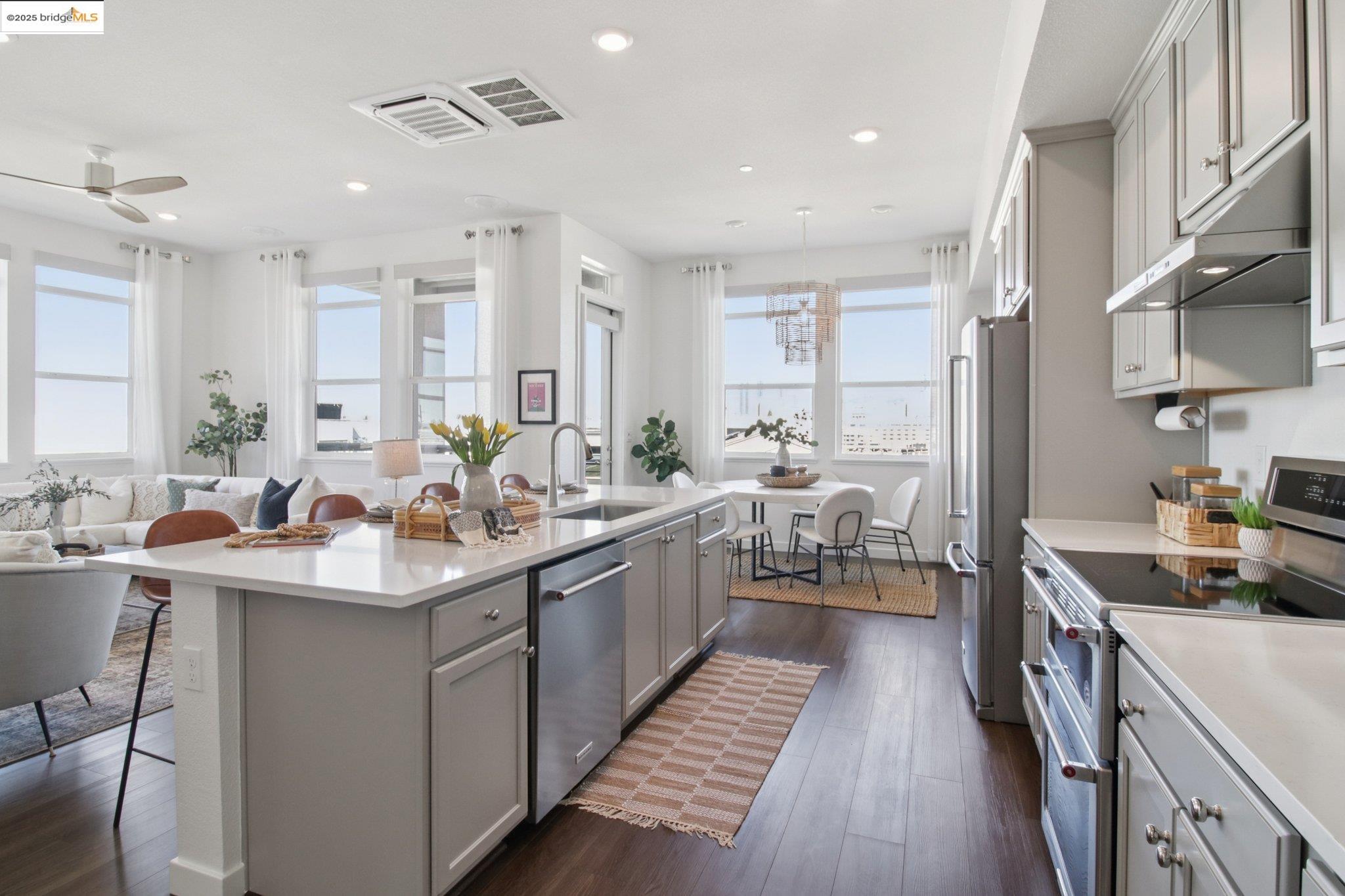 2878 5th Street Alameda, CA 94501 - Photo 15 of 56 a kitchen with counter top space a sink appliances and cabinets