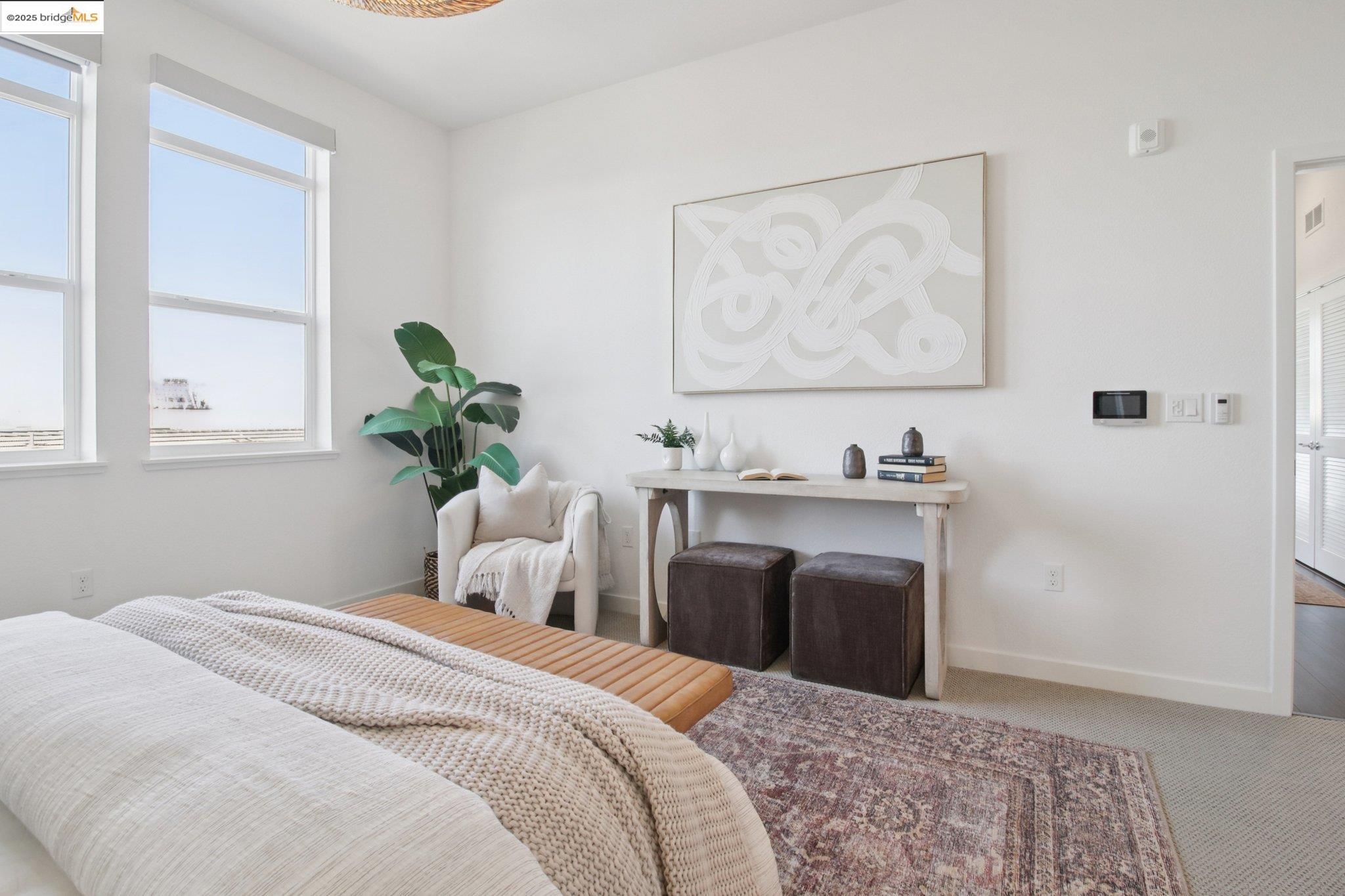 2878 5th Street Alameda, CA 94501 - Photo 21 of 56 a bedroom with a bed and a painting on the wall