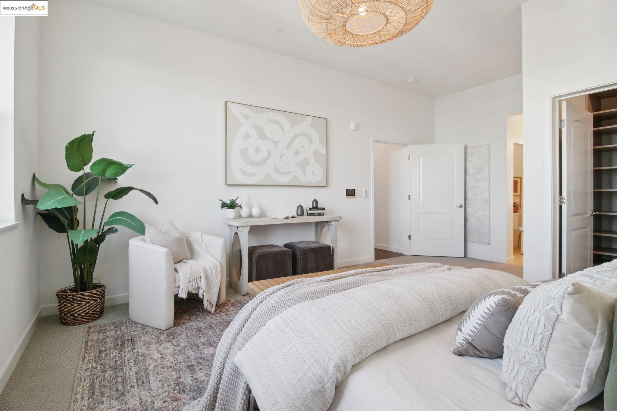 2878 5th Street Alameda, CA 94501 - Photo 22 of 56 a bedroom with bed and a potted plant