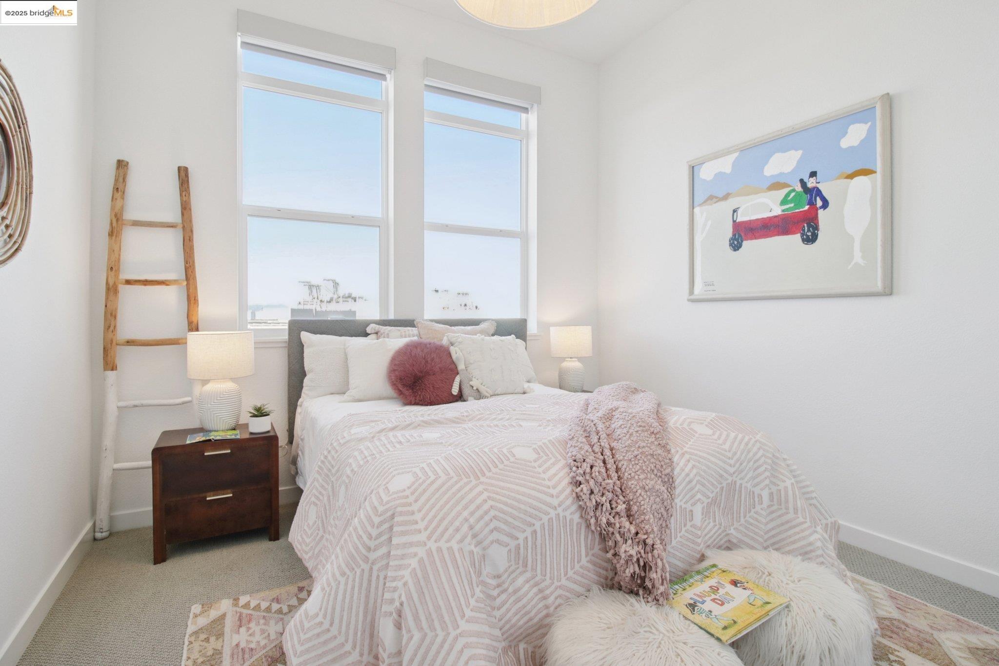 2878 5th Street Alameda, CA 94501 - Photo 25 of 56 a bed room with a bed and a painting on the wall