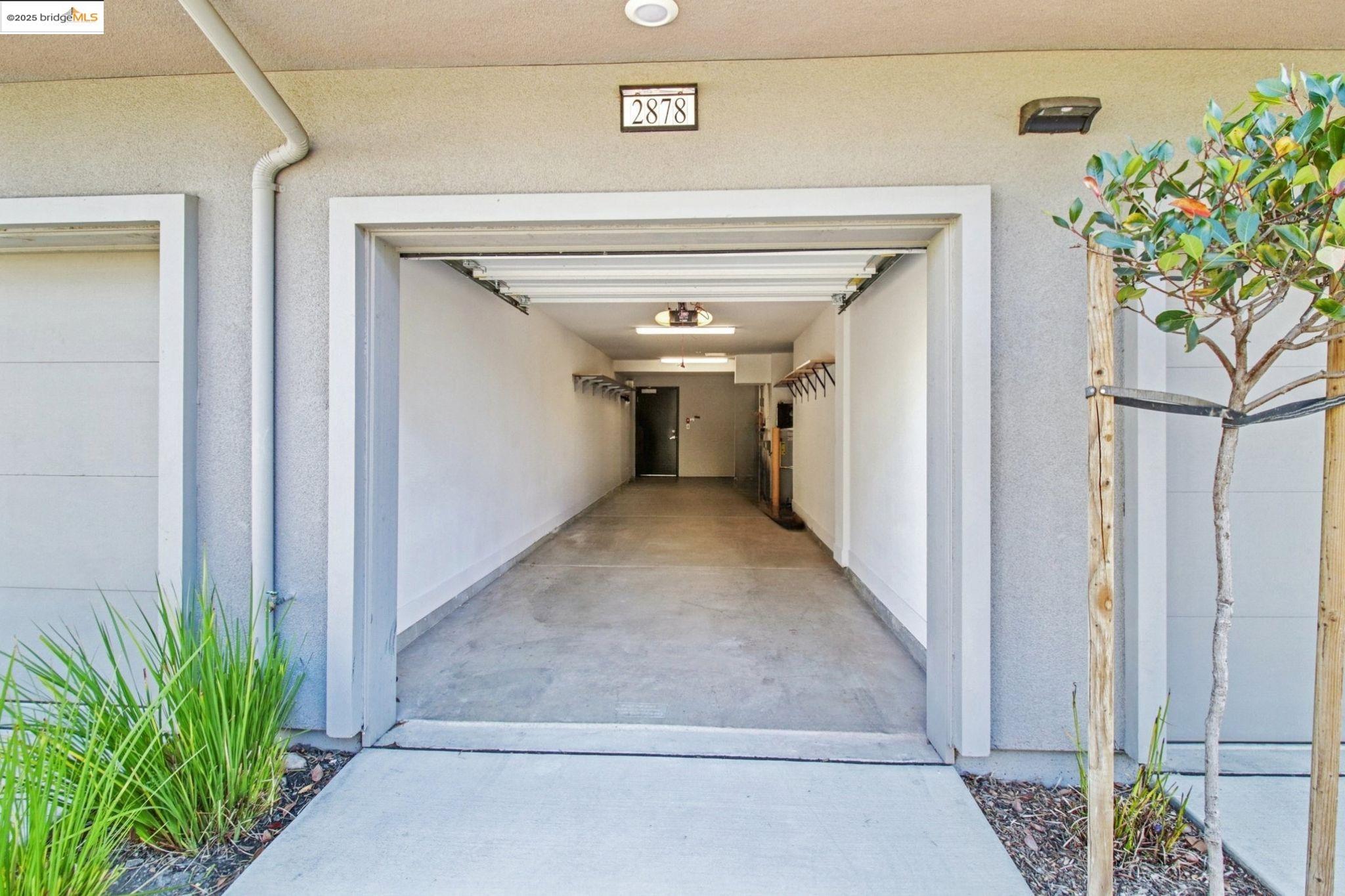 2878 5th Street Alameda, CA 94501 - Photo 30 of 56 a view of a hallway to potted plants
