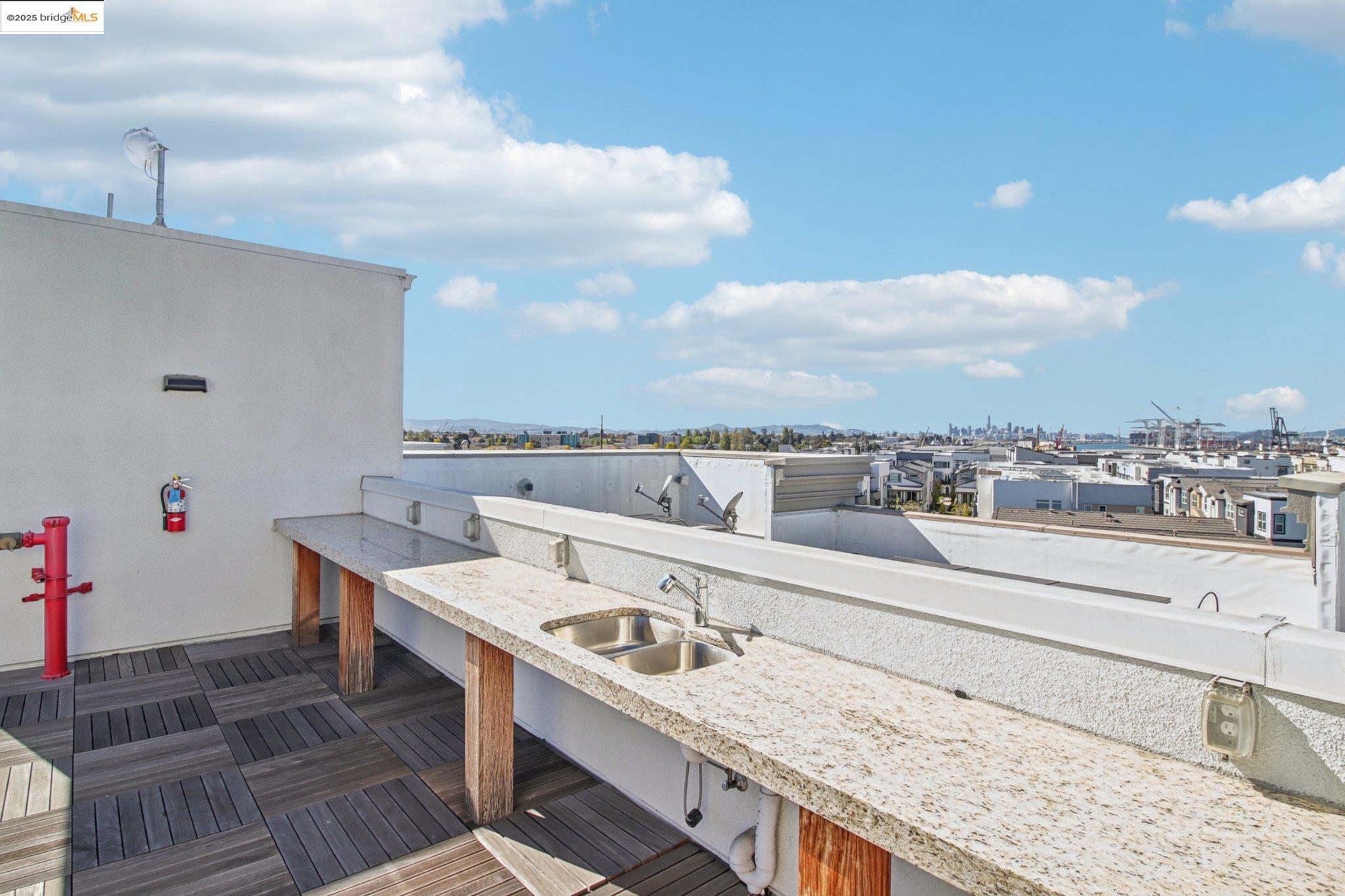 2878 5th Street Alameda, CA 94501 - Photo 36 of 56 a view of roof deck with dining table and chairs
