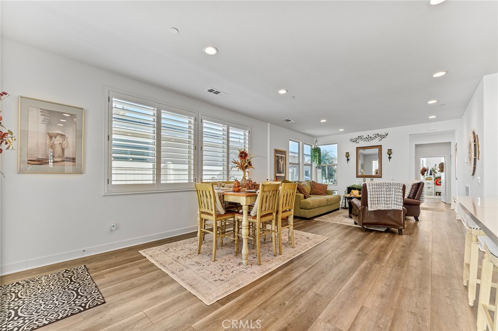 1656 Spring Run Lane Beaumont, CA 92223 - Photo 12 of 40 a living room with furniture and a wooden floor