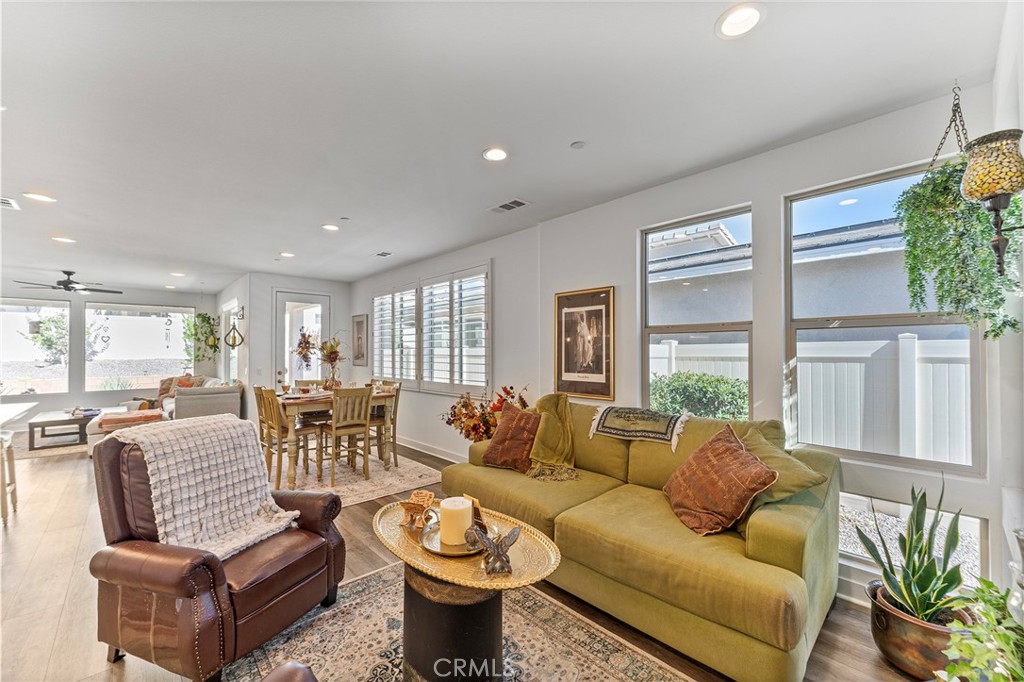 1656 Spring Run Lane Beaumont, CA 92223 - Photo 15 of 40 a living room with furniture and a large window