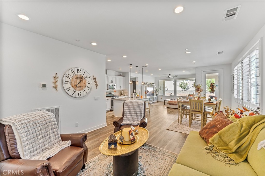 1656 Spring Run Lane Beaumont, CA 92223 - Photo 16 of 40 a living room with furniture and a large window