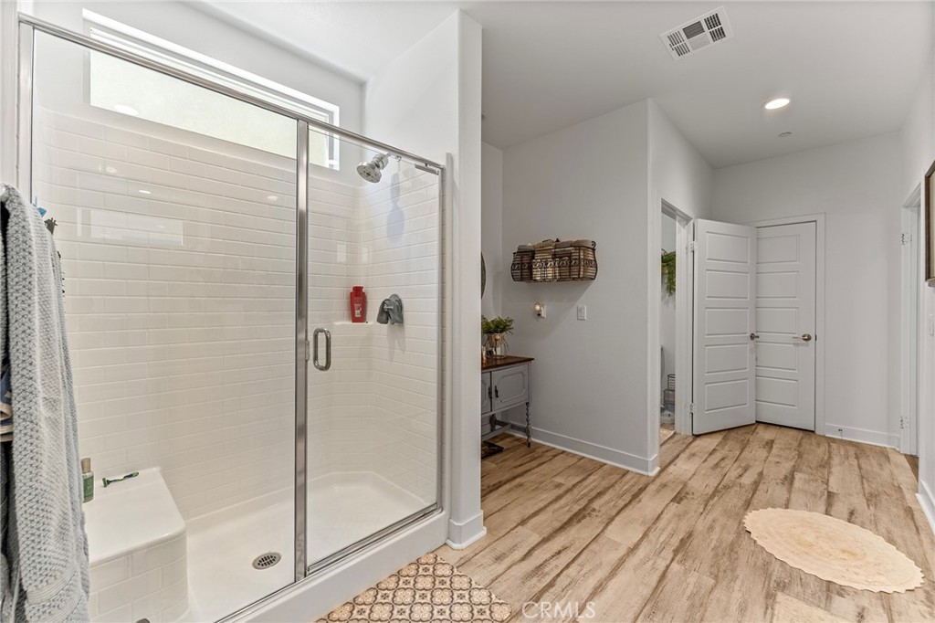 1656 Spring Run Lane Beaumont, CA 92223 - Photo 25 of 40 a bathroom with a bathtub and shower