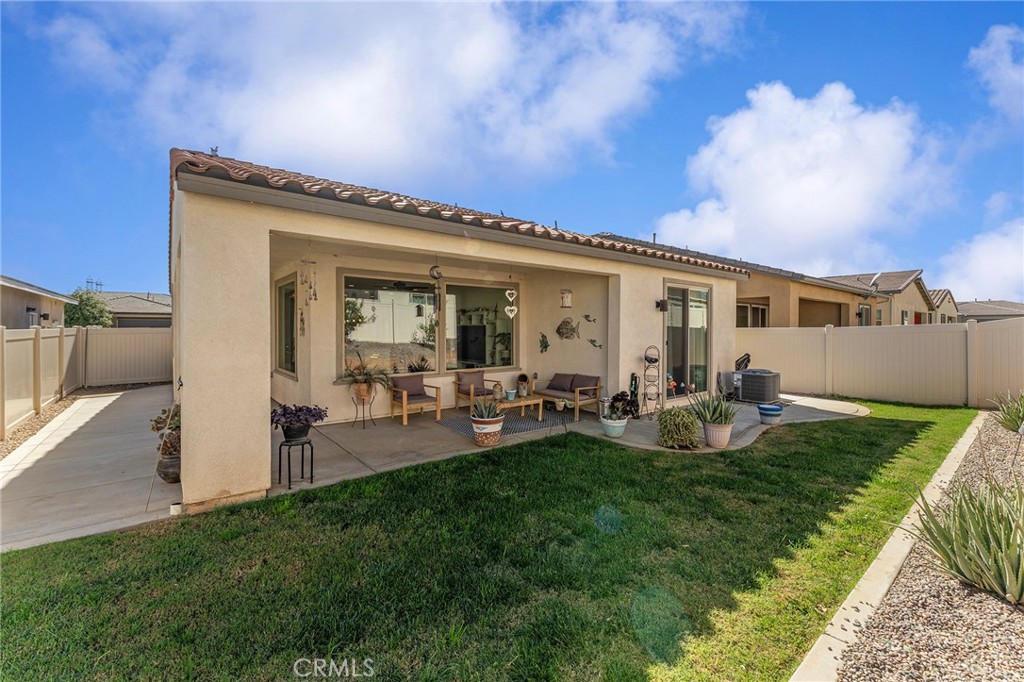 1656 Spring Run Lane Beaumont, CA 92223 - Photo 28 of 40 a view of a house with backyard sitting area and garden