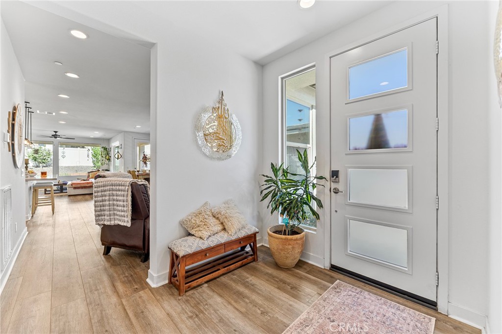 1656 Spring Run Lane Beaumont, CA 92223 - Photo 4 of 40 a living room with furniture and a potted plant