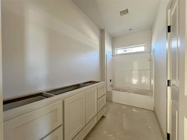 a view of storage and utility room with washer and dryer