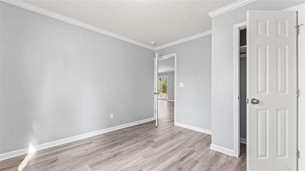804 Blanche Road Cedartown, GA 30125 - Photo 13 of 24 a view of an empty room with wooden floor