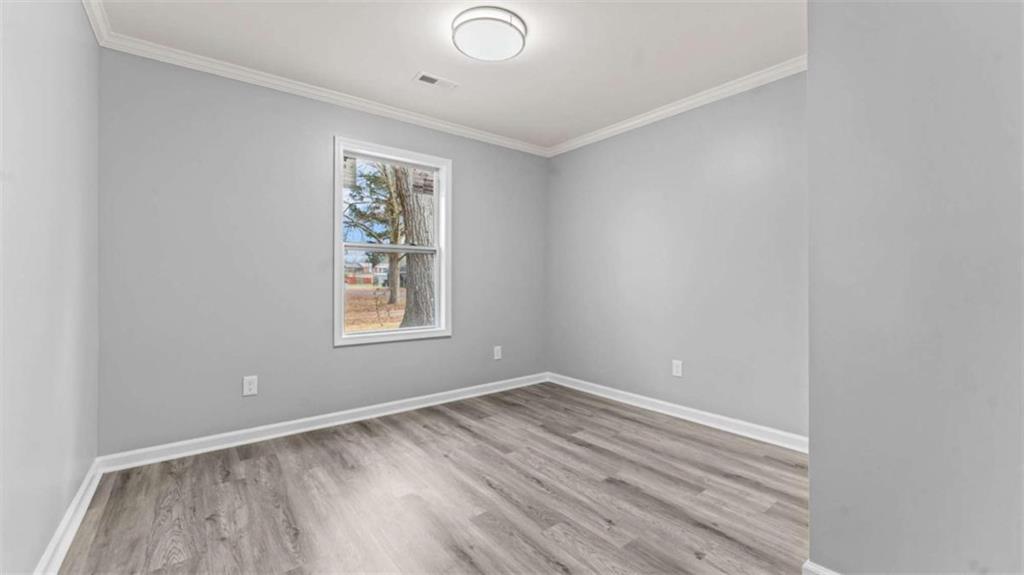 804 Blanche Road Cedartown, GA 30125 - Photo 15 of 24 a view of room with window and hardwood floor