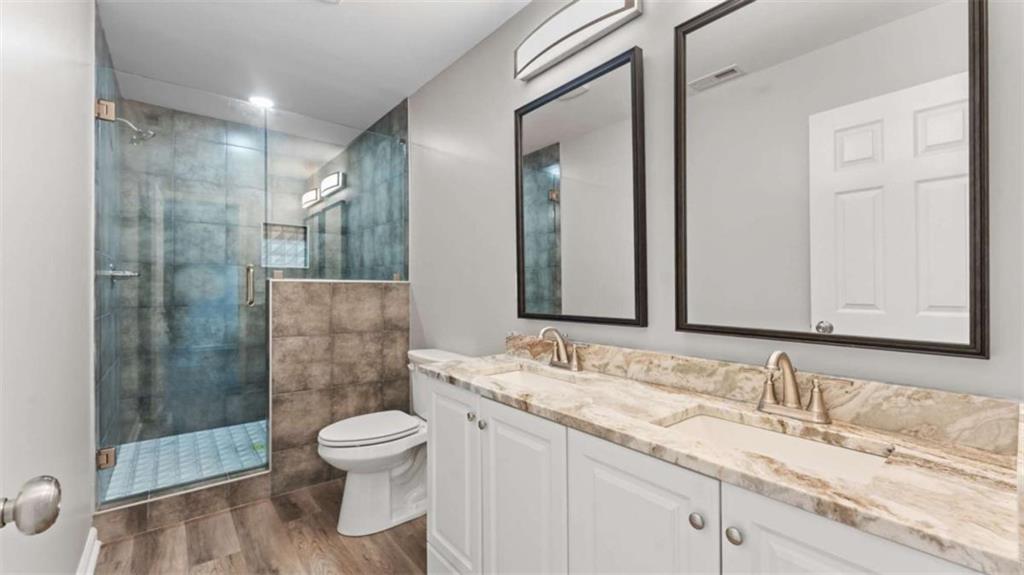 804 Blanche Road Cedartown, GA 30125 - Photo 21 of 24 a bathroom with a granite countertop sink toilet and shower