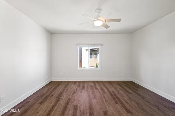 a living room with furniture wooden floor and a flat screen tv