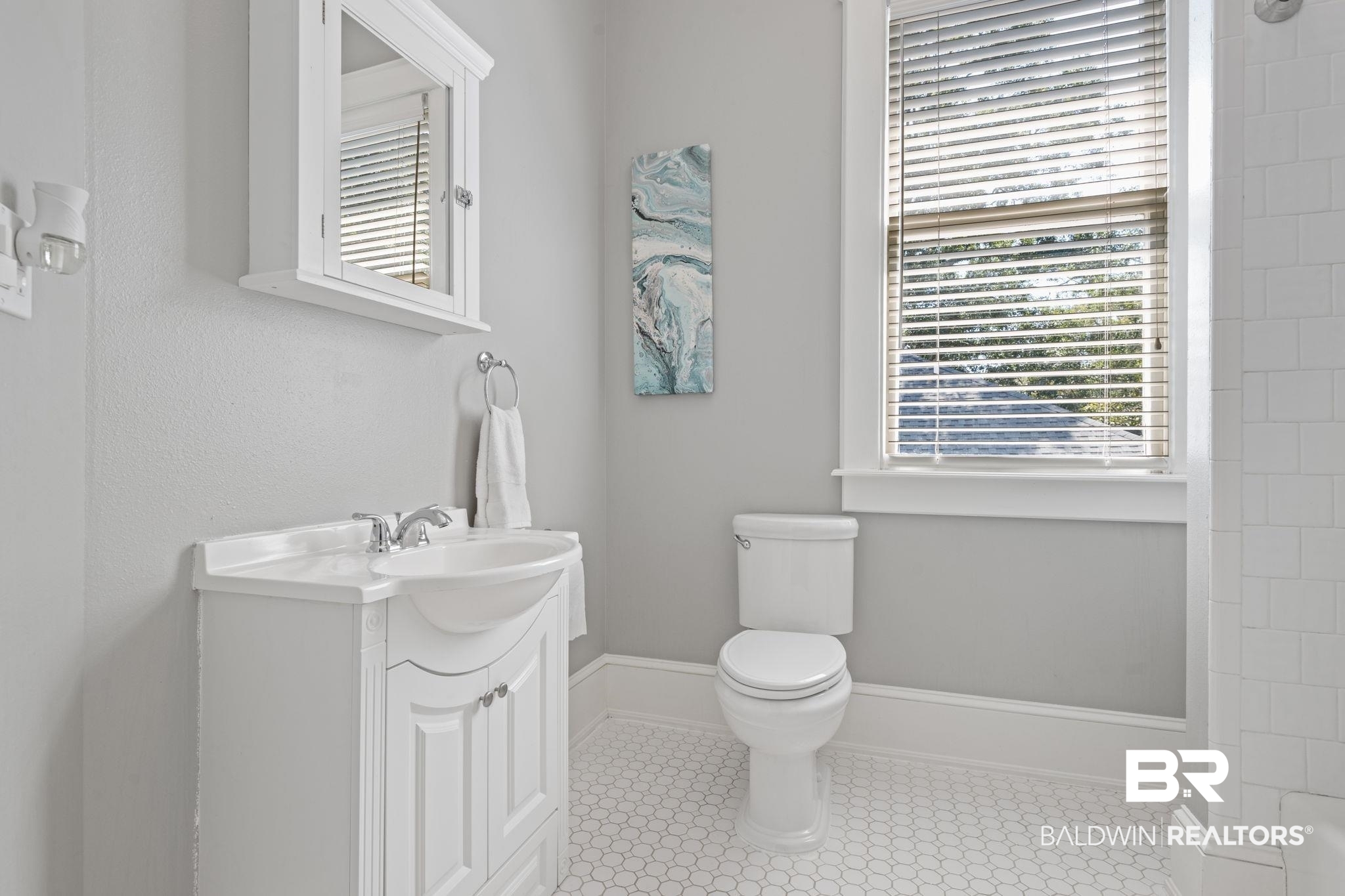 10 South Monterey Street Mobile, AL 36604 - Photo 31 of 45 Bathroom with vanity and healthy amount of natural light