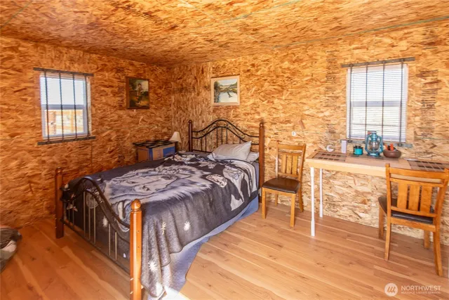 a bedroom with a bed and a table