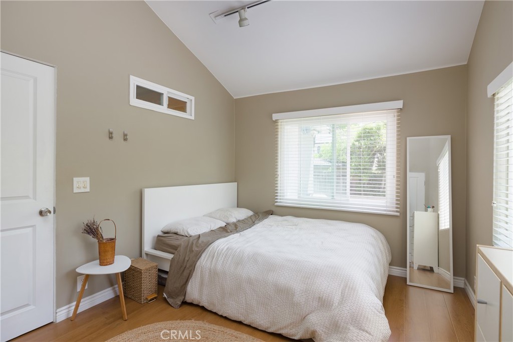 620 Beverly Drive Arcadia, CA 91006 - Photo 15 of 29 a bedroom with a bed and wooden floor