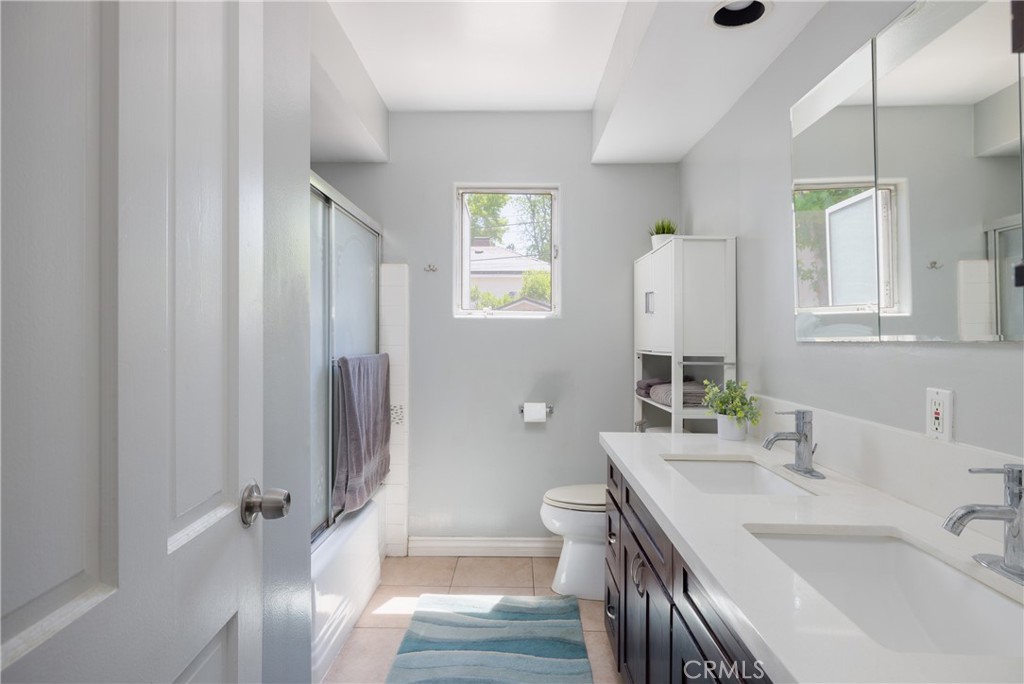 620 Beverly Drive Arcadia, CA 91006 - Photo 19 of 29 a bathroom with a sink a toilet and shower