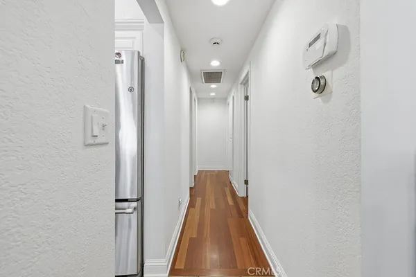 a view of a hallway with windows